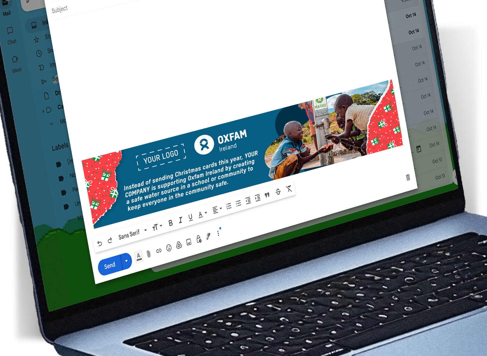 Image of a laptop with a new email open on the screen. You can see the Oxfam Corporate Unwrapped footer. The footer is festive green and and red highlighting the impact your gift has.